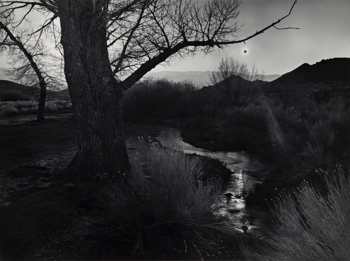 ANSEL ADAMS (1902-1984) The Black Sun, Tungsten Hills, Owens Valley, California, from Portfolio V.